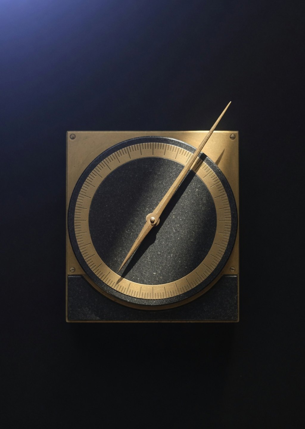 An antique gold measuring instrument — a needle over a dark stone dial with unmarked ticks — in a near-black void, struck by a single beam of light